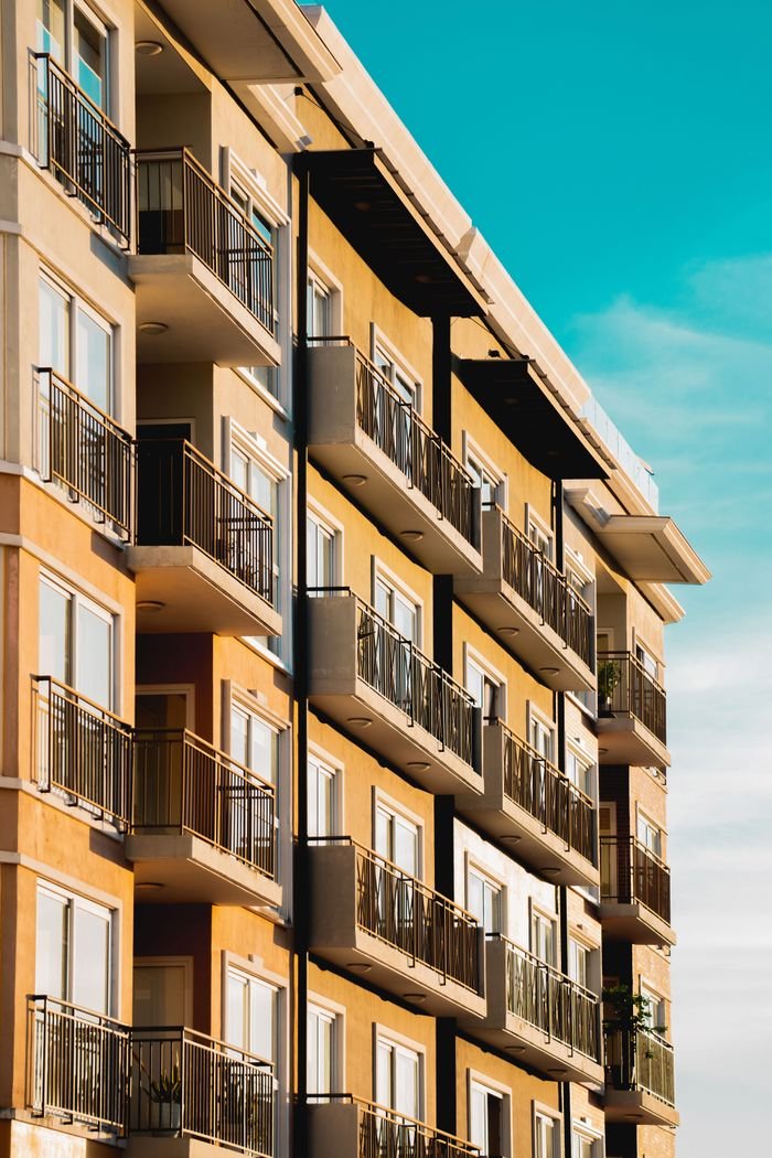 Home Contemporary apartment building with multiple balconies, capturing urban architectural style.